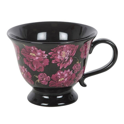 Teetasse mit dunklem, romantischem Blumenmuster